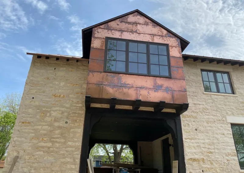 Copper metal panel facade on a stone building for Skylight Installation in Deerfield Beach