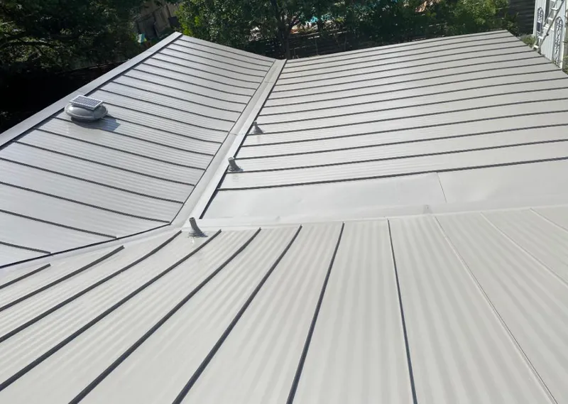 Solar attic fan installed on a metal roof for Roof Ventilation in Deerfield Beach